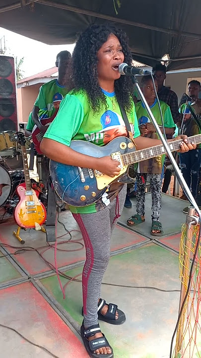 the first woman to handle guitar in history of edo state playing obito