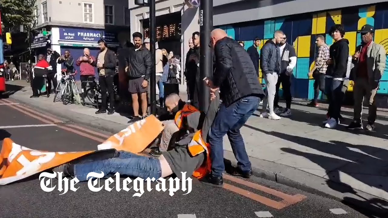 'I have to go to hospital': Motorists drag 'Just Stop Oil' protesters off the road in London