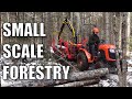 Small scale logging with a kubota compact tractor and forwarding trailer