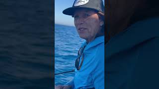 Lady angler Jolene Thompson battles a blue shark on board the Horizon below Ensemble