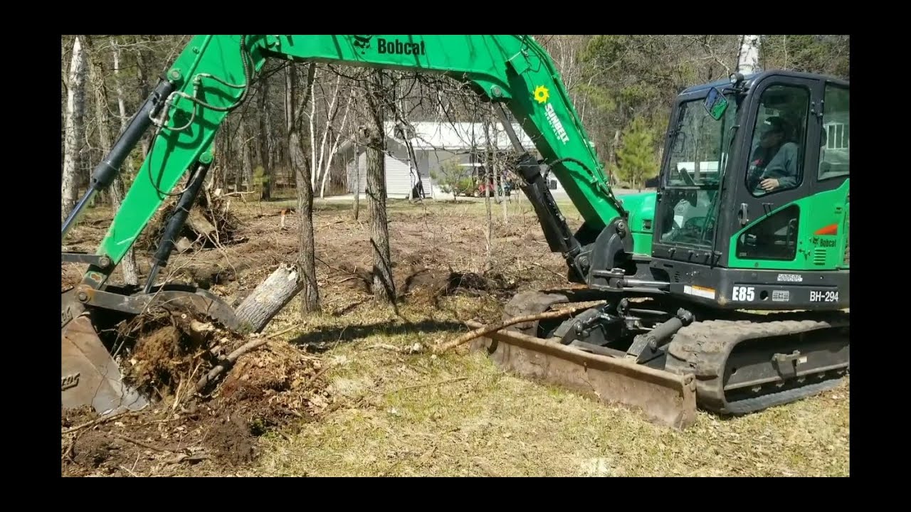 Bobcat E85 excavator digging stumps! YouTube