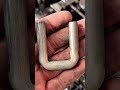 Greased gears turn, metal bends—hands guide strength into shape