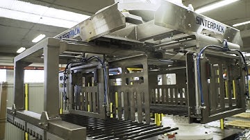 Automatic palletizing system for plastic crates containing milk bags