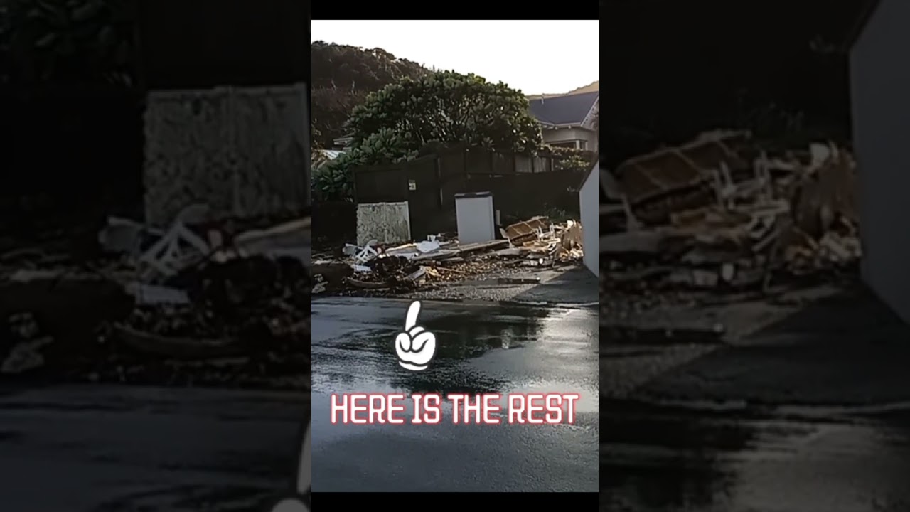 Boat wrecked on shore in heavy storm. 