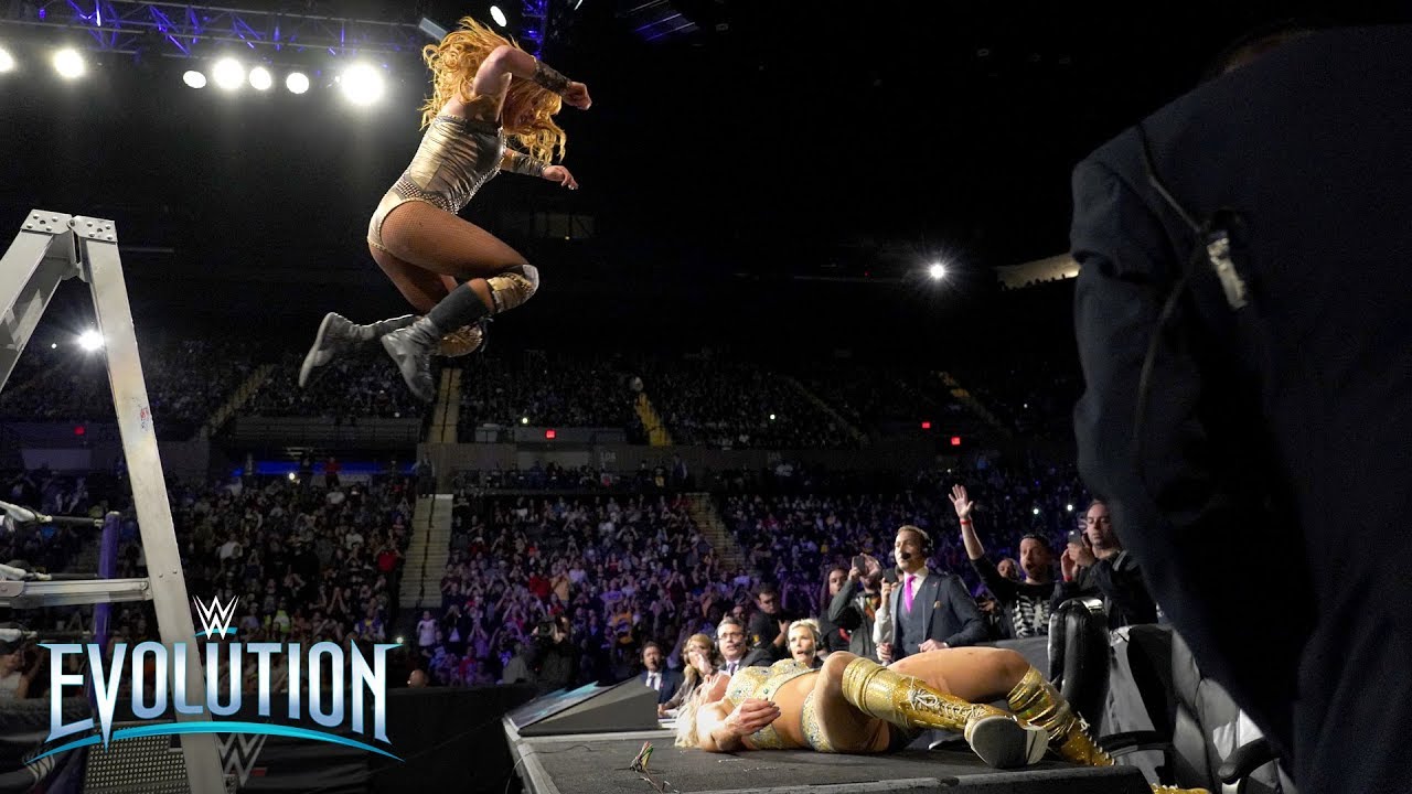 Becky Lynch's ladder leap sends Charlotte Flair through announce table: WWE Evolution 2018