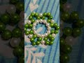 beautiful flower with green and white beads