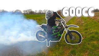 600cc dirtbike does a burnout through asphalt