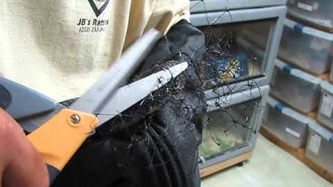 Black Snake Tangled In Netting