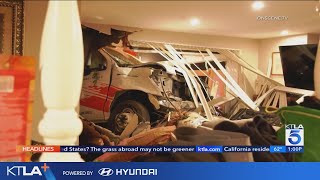 Man crashes U-Haul truck into home, flees with dog