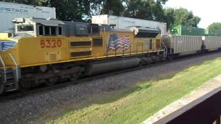 UP 8779, 5087, 4128 leading stack with DPUs 8760 and 8985, meeting WB coal train