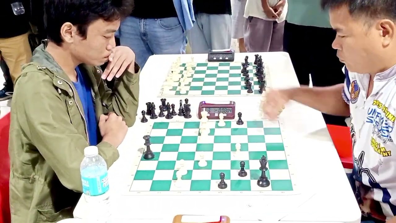 1st DXN OPEN RAPID CHESS TOURNAMENT.King Hunt: NM Christian Tolosa VS FM Raymond Salcedo 