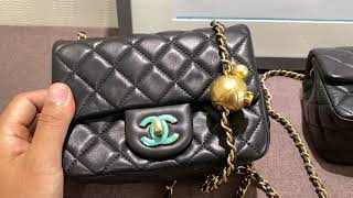 chanel flap bag with ball on chain