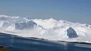 Ilulissat Icefjord  iceberg turning over.