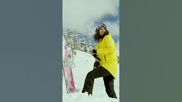 A Woman Taking a Photo of a Snowboard #shorts #viral