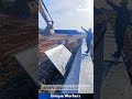 Concrete Wall Construction: Using Crane to Lift and Position Wall Forms