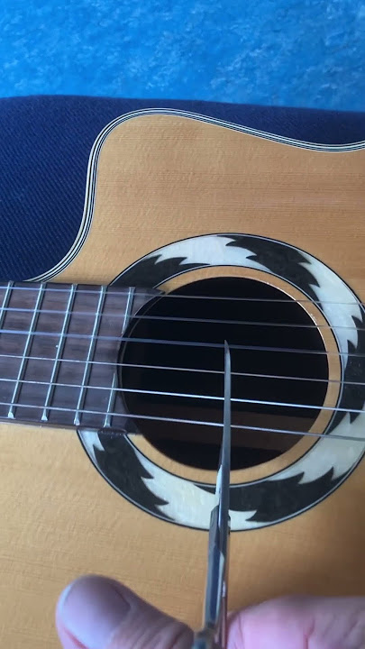How do I change the strings on a classical guitar? #guitar