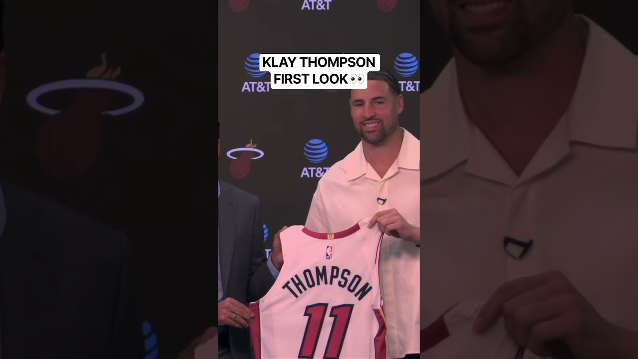 First look at Miami Heat Klay Thompson as he holds up his new jersey to start his intro presser