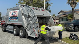 Nasa Services Peterbilt 320 McNeilus Rear Loader Garbage Truck Eating a Mattress