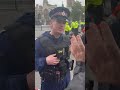 Policeman tries to shush bystander