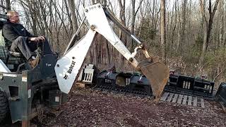 Bobcat 709 skidsteer backhoe