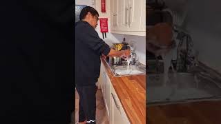 Amazing Husband Happy Cleaning Dishes And Kitchen Worktop