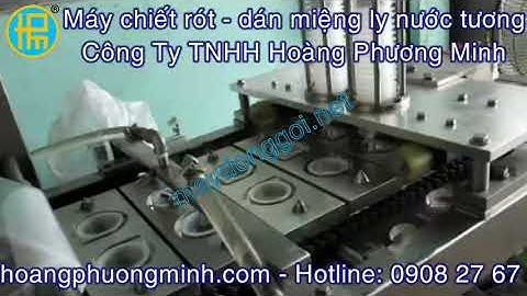 Máy chiết rót - dán miệng ly nước chấm (băng tải)