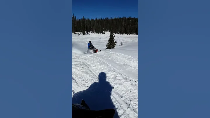 7 year old daughter Snowmobile jumping with daddy