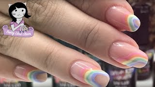 Hi, it's amy and today we're doing a spring-inspired set of rainbow
nails with pastel colours. starting base shy time on all the nails.
i'...