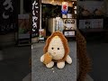 商店街でタイ焼きを食べるあみぐるみ