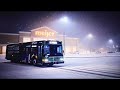 GREEN SMART GILLIG ADVANTAGE LOW FLOOR PULLING UP AT MEIJERS FOR BUS BREAK ON COLD SNOWY NIGHT 