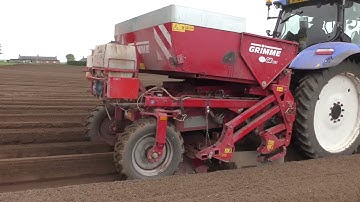 New Holland tractor and Grimme potato planter