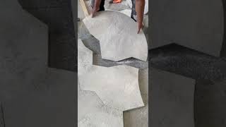 Worker installing textured hexagonal concrete floor tiles #shorts
