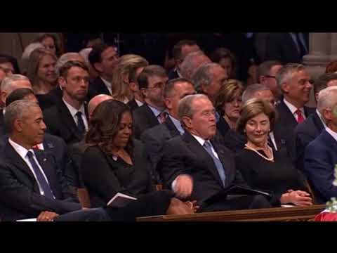 George W. Bush and Michelle Obama share candy at McCain memorial