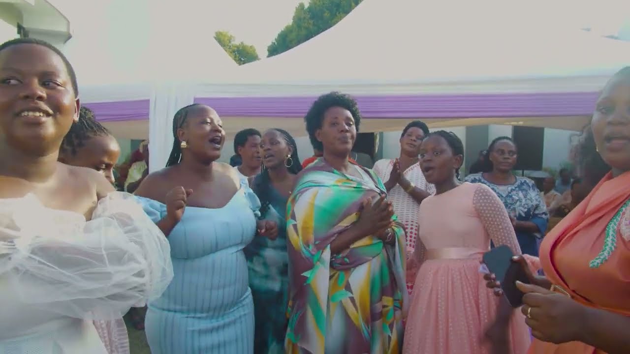 Daughters of Late Kamukama Robert thank their mum Annah Inid for standing in their late Dad's shoes