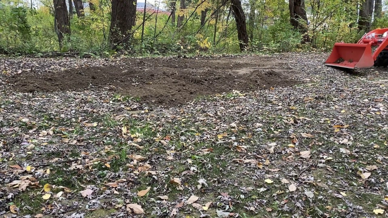 Kubota BX spreading dirt and leveling ground YouTube