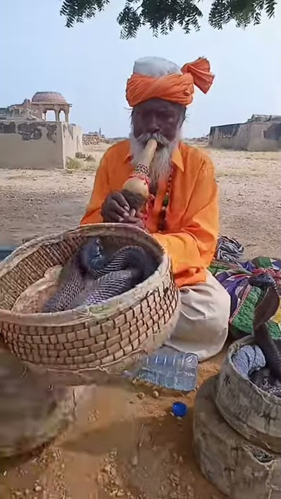 Sindhi Jogi Baba Playing Traditional Flute at Makli Graveyard Sindh