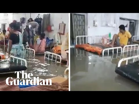 Hospital and homes submerged in India as floods kill more than 100