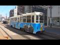 函館市電 800形812号車 ゴールデンカムイラッピング 五稜郭公園前停留所発車