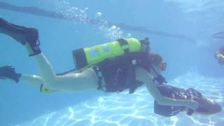 Katie driving the Sea Doo DPV around the new pool