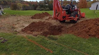 Digging Footer Holes for a Future Pavilion with Kubota LX and BH77.