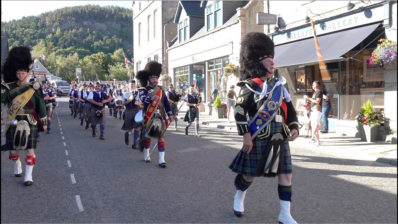 Mace flourish from Drum Majors leading Aberlour & Towie Pipe Bands