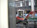 Guy digging up the road whilst having a cig.