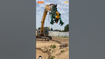 The image shows an excavator (a Sumitomo machine) with a specialized attachment mounted