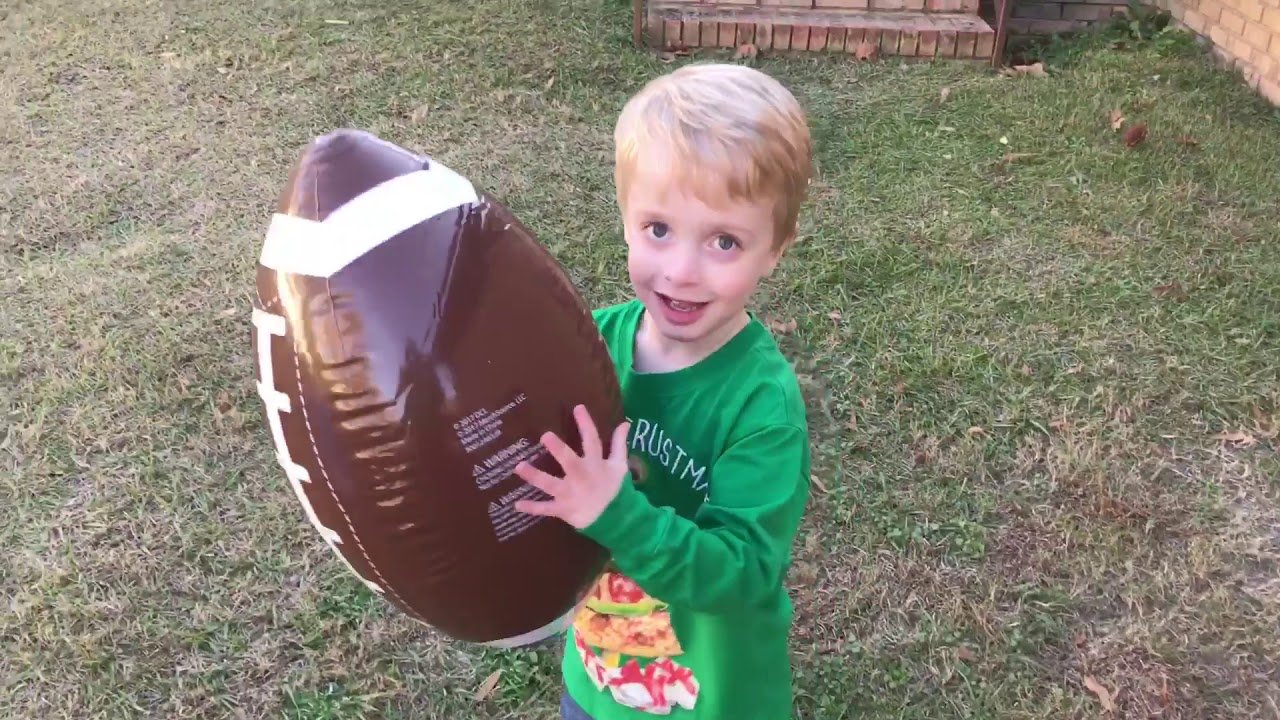 Grady Plays with the Discovery Inflatable Football Set