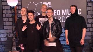 California-based alternative rock band The Neighbourhood poses on the 2013 Video Music Awards.