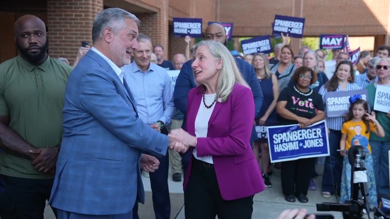 Democrat Spanberger and Republican Reid meet at polls on first day of early voting in Virginia
