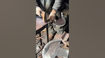 A curved metal piece is shaped carefully to create a strong hanger for the axe handle today #viral