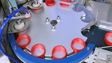 two heads induct foils inserting wadding equipment caps lifting feeding wads lining machinery