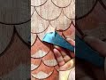 ornamenting fish scale carvings using a chisel for charming and textured artistic details