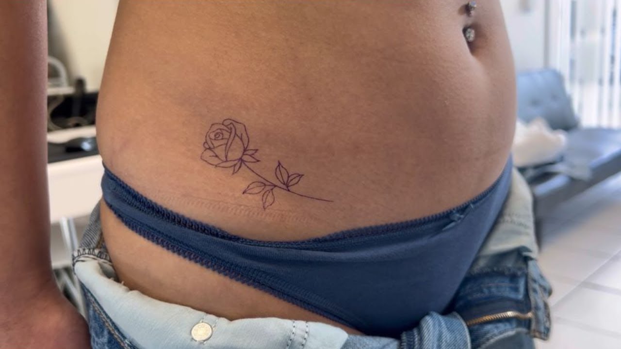 Beautiful flower tattoo designs sunflower or rose on the side of your  lower stomach